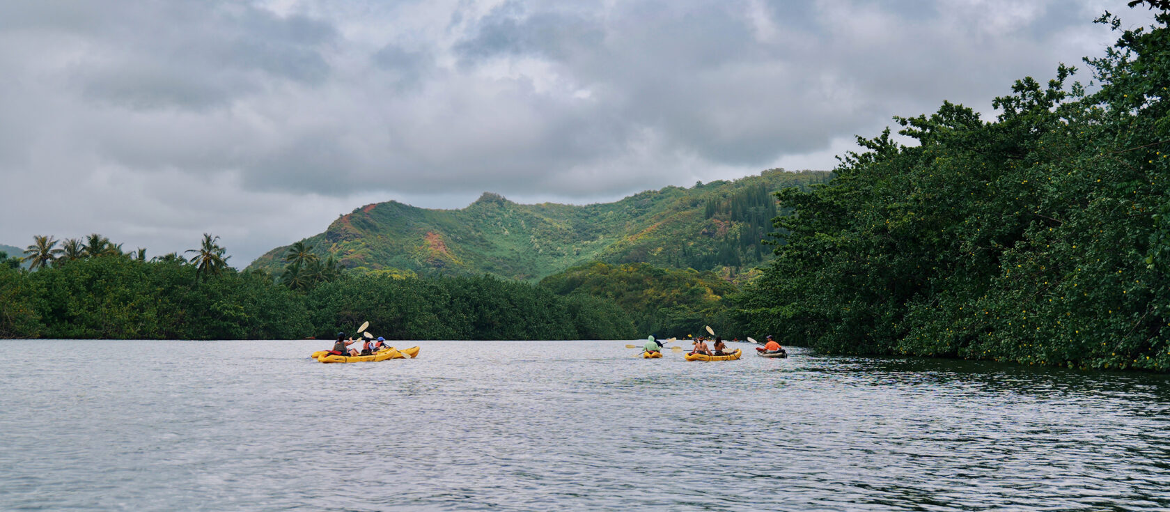 Group of teens sea kayaking in Hawaii.