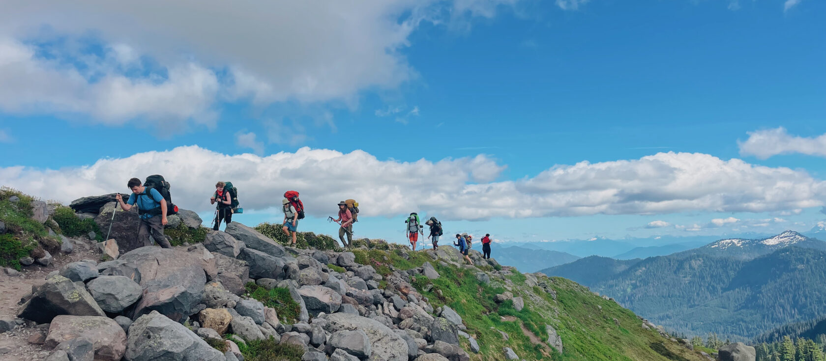 High school students hiking on a ridge in the Pacific Northwest.