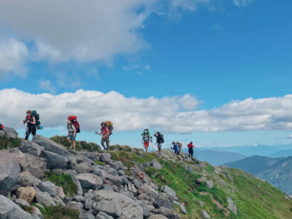 High school students hiking on a ridge in the Pacific Northwest.