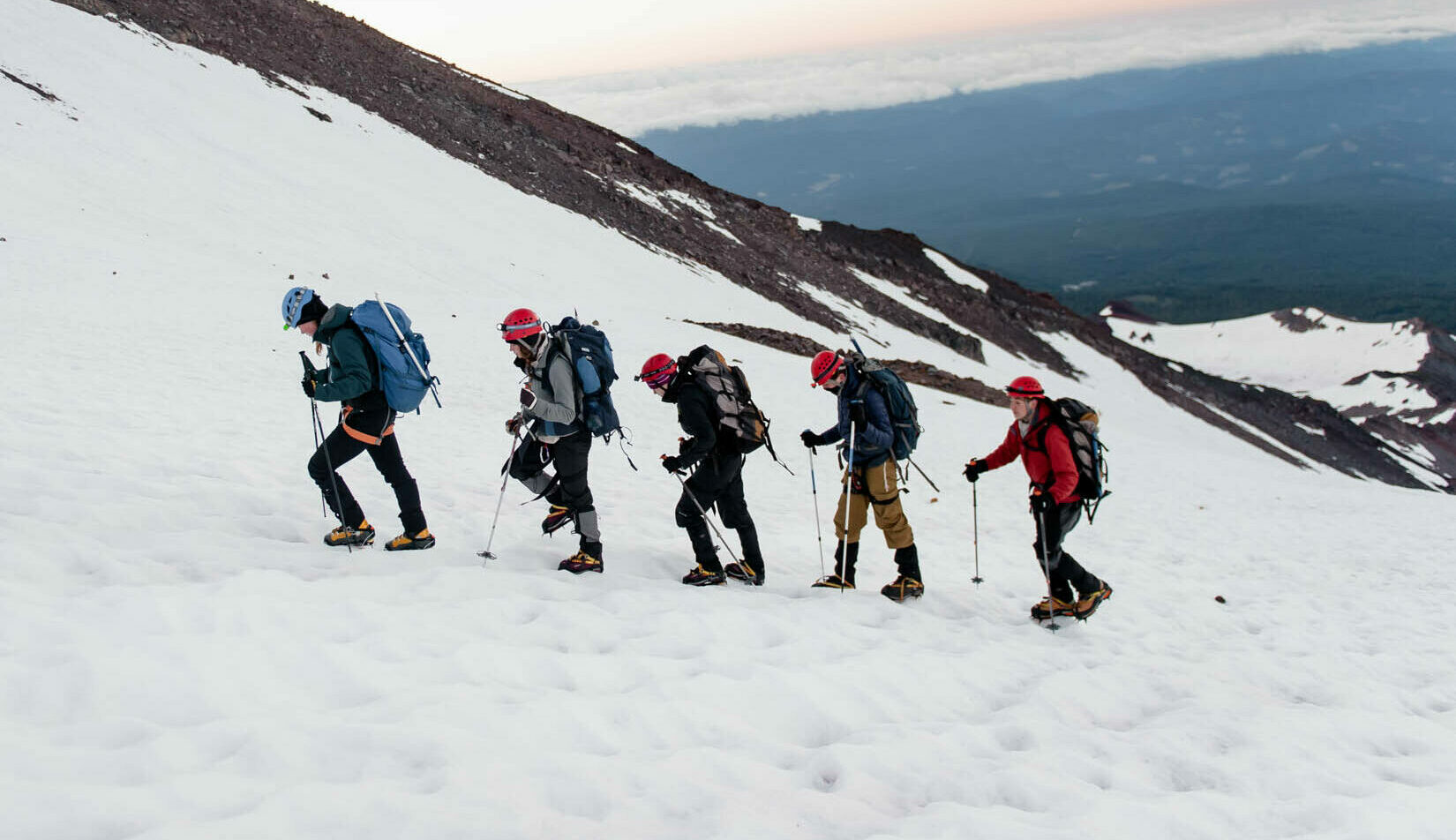 Travelers hiking up Mount Shasta in the snow