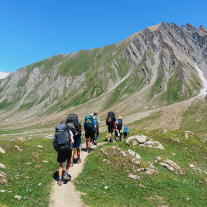 group of students hiking in the european alps in zermatt