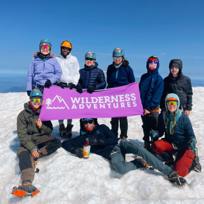 Group of middle schoolers on the summit of Mt. Adams in the Pacific Northwest.