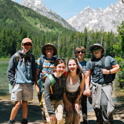 Group of kids hiking in Grand Teton National Park in the summer.