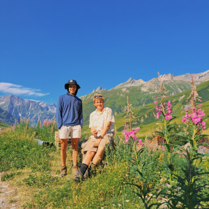 Two high school boys sitting in the European Alps.