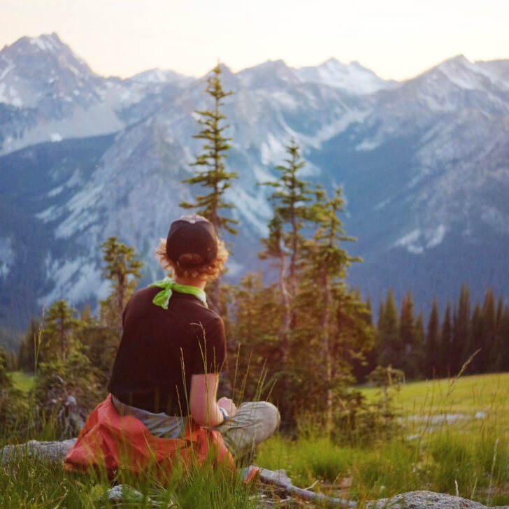 Person watching the sunset in the Cascade Mountains of the Pacific Northwest.