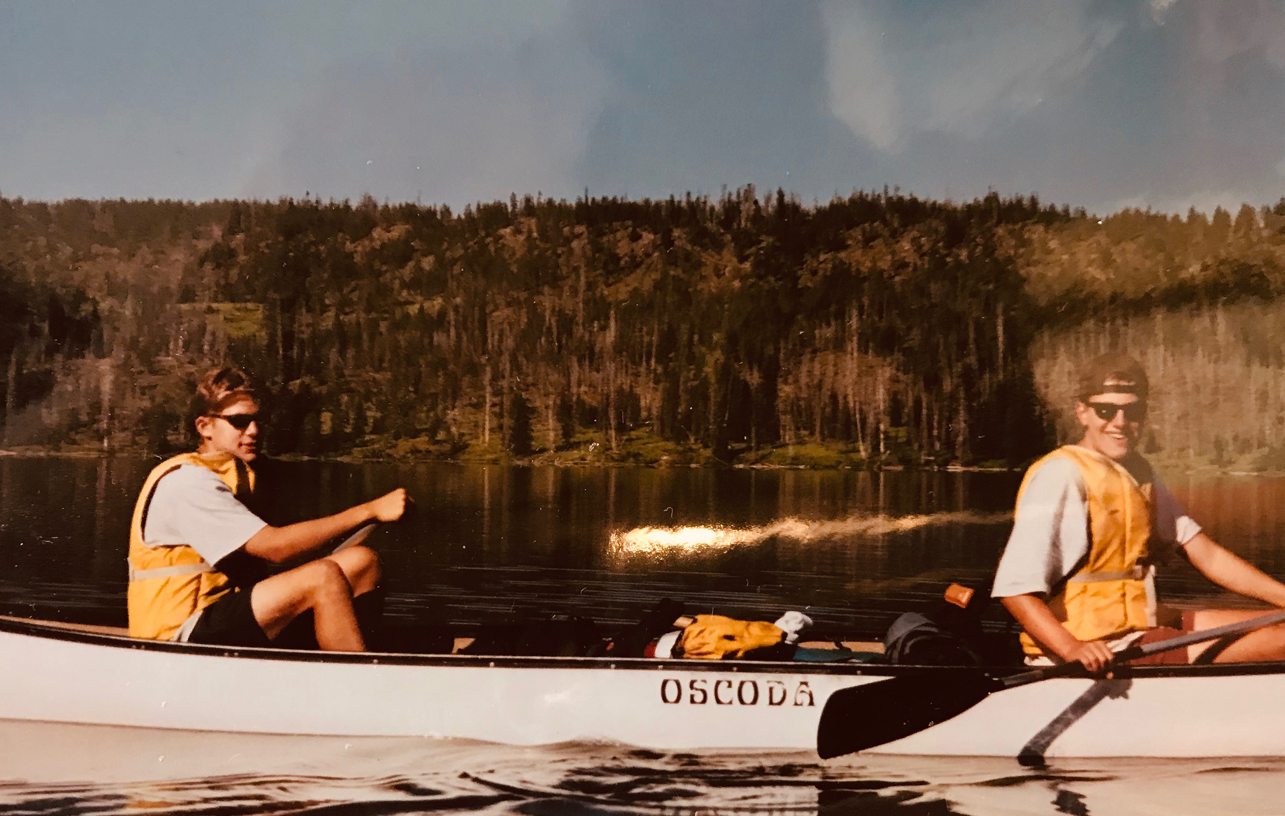 Tom Holland and a fellow camper in a canoe in the 1980s.