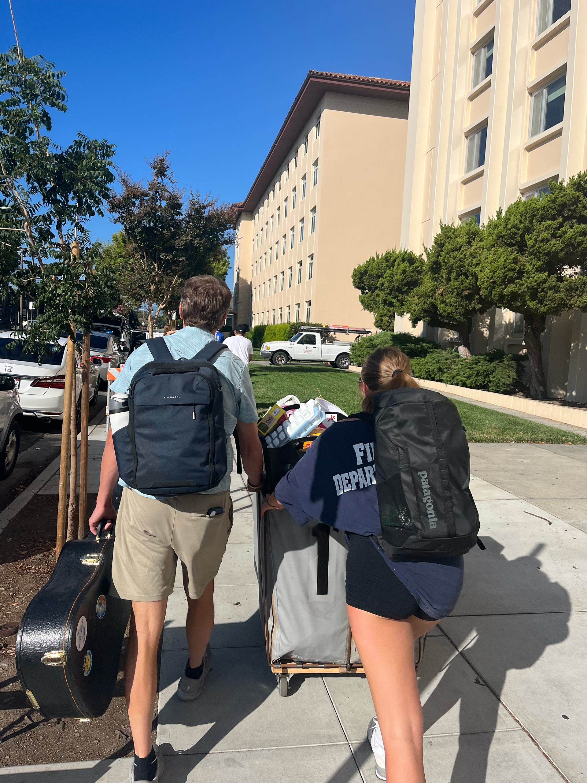 Tom Holland walking with his daughter, Mads, to college drop off. 