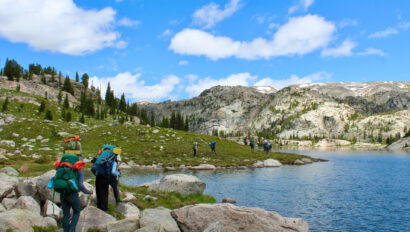 People backpacking in Wyoming on a summer adventure for teens.